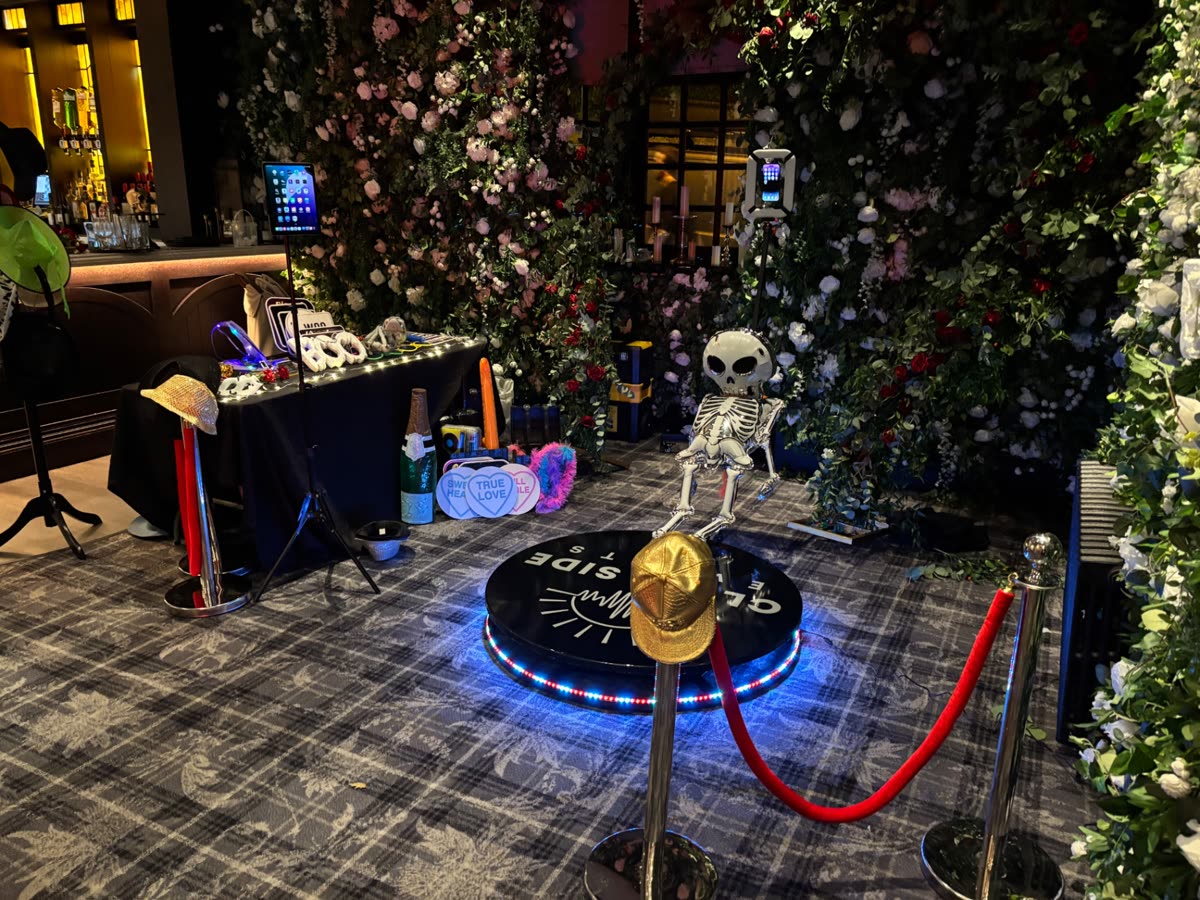 360 video booth set-up with flower wall and red carpet