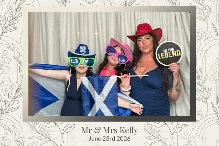 Botanical framed wedding photo booth print of three guests in cowboy hats holding a Scotland saltire flag at Mr & Mrs Kelly's wedding, 23rd June 2026