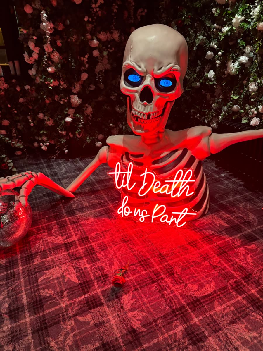 Halloween wedding ‘til Death do us Part’ neon and skeleton set-up