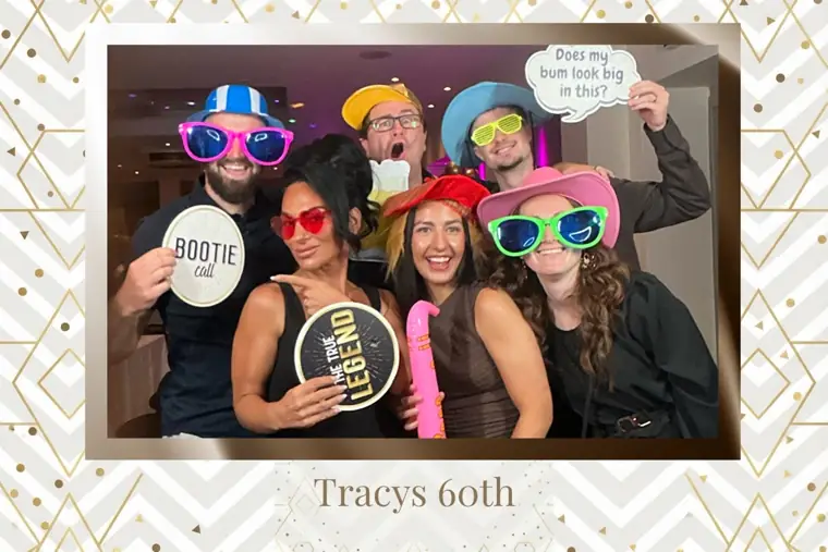 Gold chevron bordered party photo booth print of six guests in oversized sunglasses and hats at Tracy's 60th birthday
